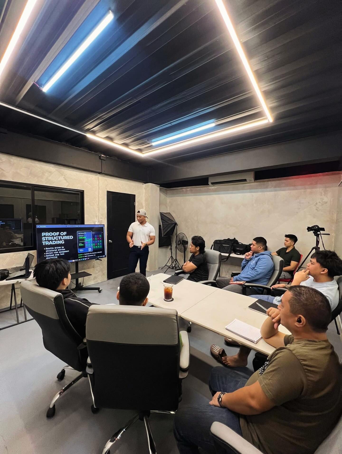 Cryptoshua leading a live in-person trading workshop